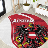 Round red carpet rug with Austria National Day text and black eagle crest