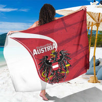 Red Austria eagle graphic sarong with “National Day AUSTRIA” text and white trim