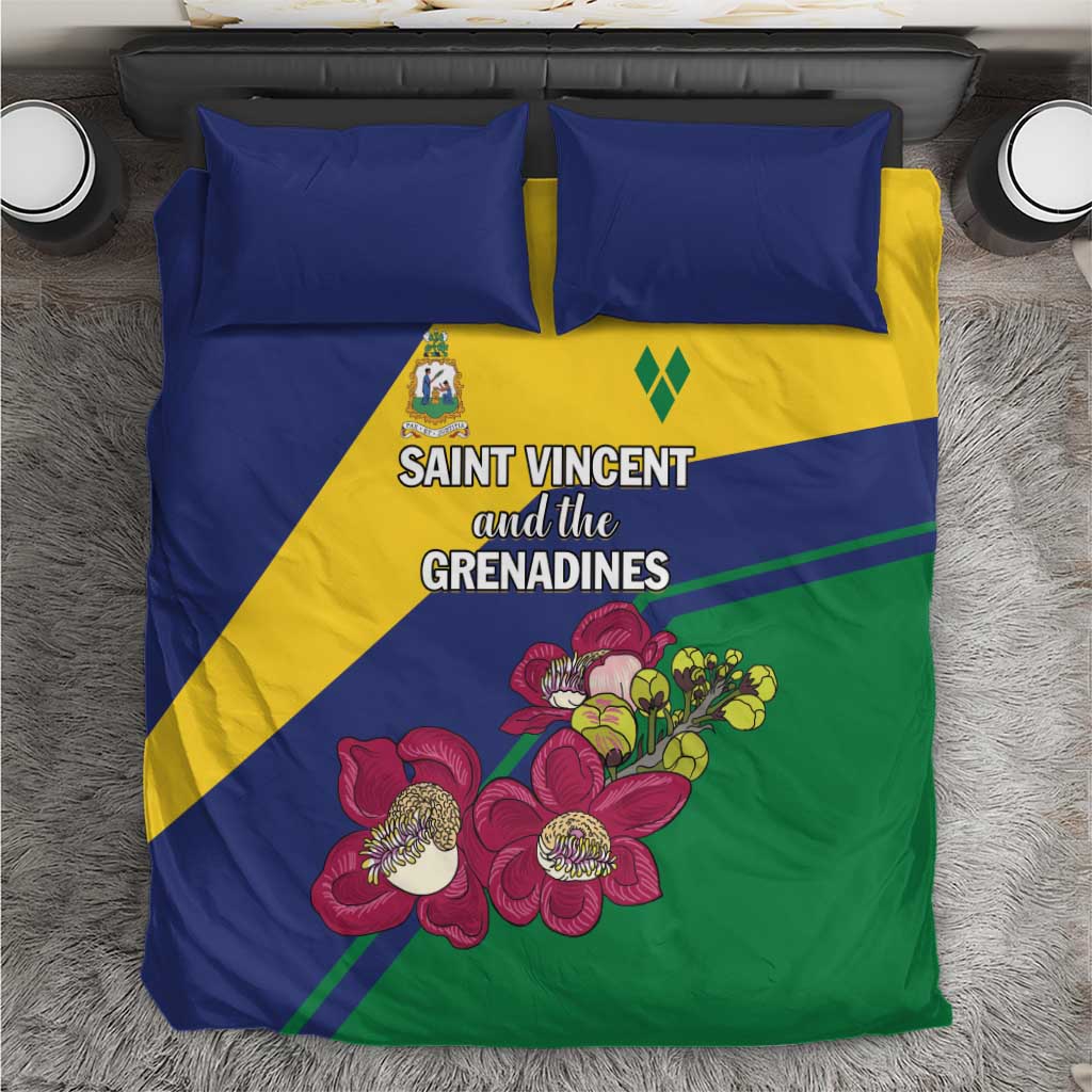 Blue, yellow & green bedding set with floral print and two coordinating blue pillows.