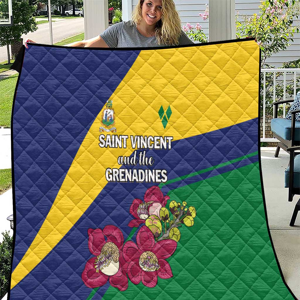 Quilt with quilted texture, diagonal blue-yellow-green stripe and floral bouquet.