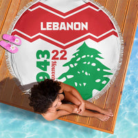 Lebanon round beach blanket with red chevrons, 'Lebanon' text and green cedar, fringe