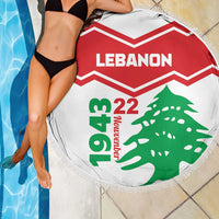 Lebanon round beach blanket with red chevrons, 'Lebanon' text and green cedar, fringe