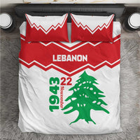Red and white bedding set with zigzag pattern, LEbanon text, and green cedar tree graphic