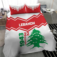 Red and white bedding set with LEbanon headline, green cedar tree, and chevron stripes