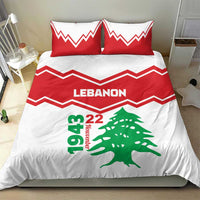 Red and white duvet with LEbanon text, green cedar tree, and red chevron stripe design