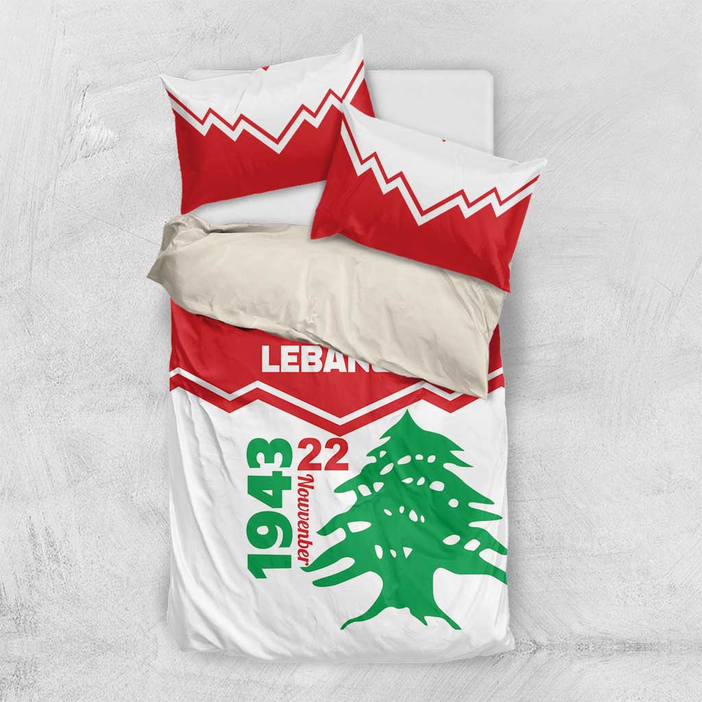 Folded red and white bedding set with pillowcases, LEbanon text, zigzag stripes, cedar tree