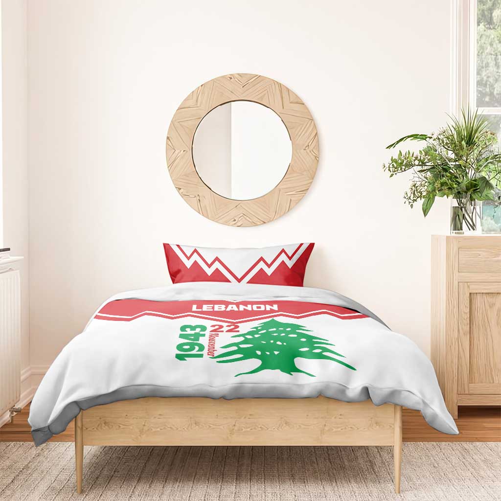 Red and white duvet and pillow set with LEbanon text, green cedar tree, and zigzag stripes