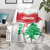 White Lebanon independence day blanket on armchair, red chevrons and green cedar tree