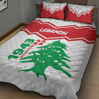 Quilt bed set with white quilt, red zigzag stripes, green cedar and “Lebanon 22” text