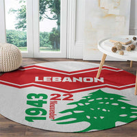 Round Lebanon-themed area rug with red chevron stripe and green cedar tree graphic