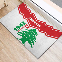 Rubber doormat corner view with Lebanon text and green cedar tree on light gray