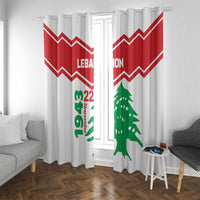 White window curtains with red chevron stripes and green cedar tree and Lebanon text