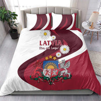 Red and white Latvia duvet cover with crest and daisies, paired with matching pillowcases