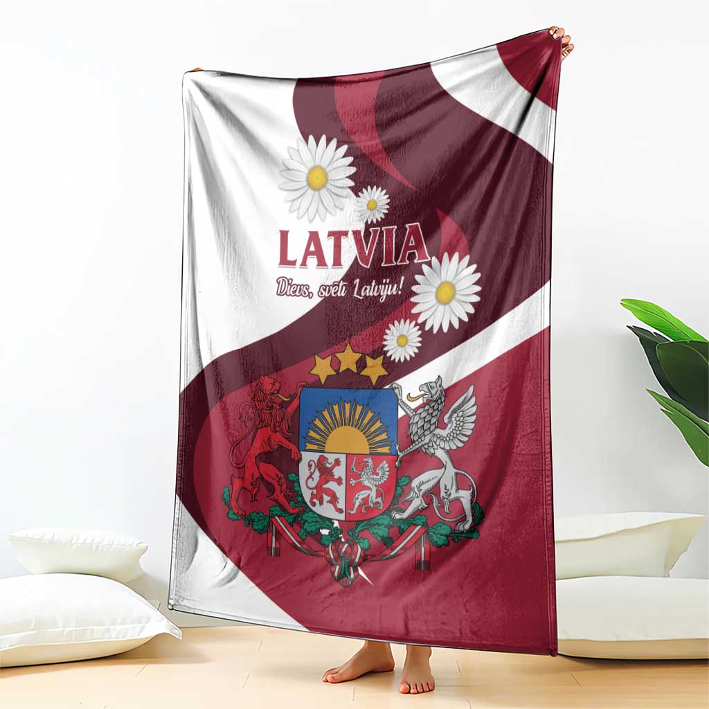 Latvia flag-style blanket draped with LATVIA lettering, daisies, coat of arms and eagle