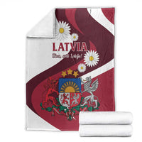 Latvia flag-style blanket folded, red-and-white stripes with LATVIA, daisies, eagle and crest