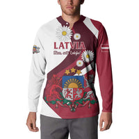 Red and white button sweatshirt with Latvia crest, daisies, and bold 'LATVIA' print