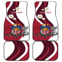 Set of 4 red car floor mats with Latvia crest, daisies, and 'YOUR TEXT' front/back