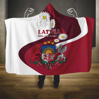 Hooded Latvia blanket draped over shoulders in white and red with flag emblem
