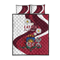 Red and white quilt with Latvia crest and daisies, plus two striped pillow covers