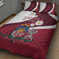Red and white quilt bed set with Latvia crest, stars, daisies, and two striped pillows