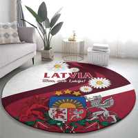 Red round area rug with Latvia title, daisies, and Latvian coat of arms