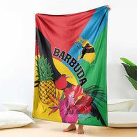 Colorful tropical throw blanket with BARBUDA text, birds, hibiscus and pineapple print