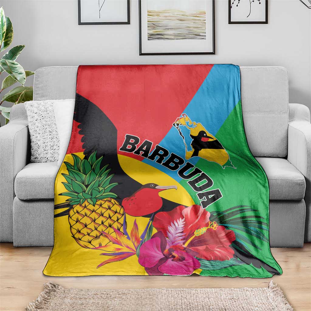 Tropical blanket featuring birds, bright flowers, pineapple, and BARBUDA word graphic