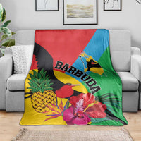 Tropical blanket featuring birds, bright flowers, pineapple, and BARBUDA word graphic