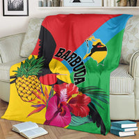 Colorful tropical blanket with BARBUDA lettering, birds, hibiscus blossoms and palm fronds