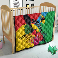 Tropical quilt for crib with bird, pineapple and hibiscus graphics on quilted fabric.