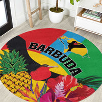 Round tropical area rug with Barbuda text and toucan bird, red blue green border