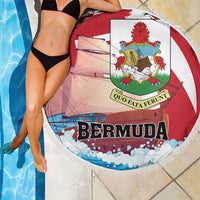 Red round beach blanket with white fringe, Bermuda lettering and coat-of-arms crest over swimmer
