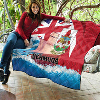 Bermuda quilt throw blanket laid on patio seating, red and blue waves with crest