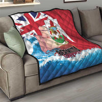 Bermuda quilt throw blanket draped on sofa, quilted red and blue flag design