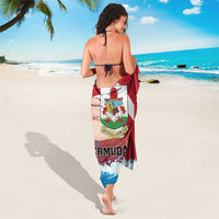 Red, blue, and white Bermuda sarong worn as a tie wrap, crest centered