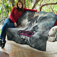 Gray quilt held on patio with Pegasus Horse Racing 2025 artwork and diamond quilting
