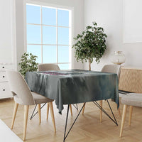 Gray tablecloth with dark racing-style graphic, draped over dining table