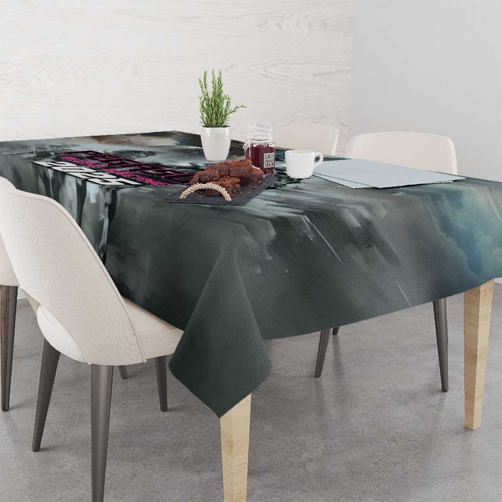 Gray tablecloth with dark abstract racing pattern, draped over square dining table