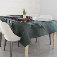 Gray tablecloth with dark abstract racing pattern, draped over square dining table