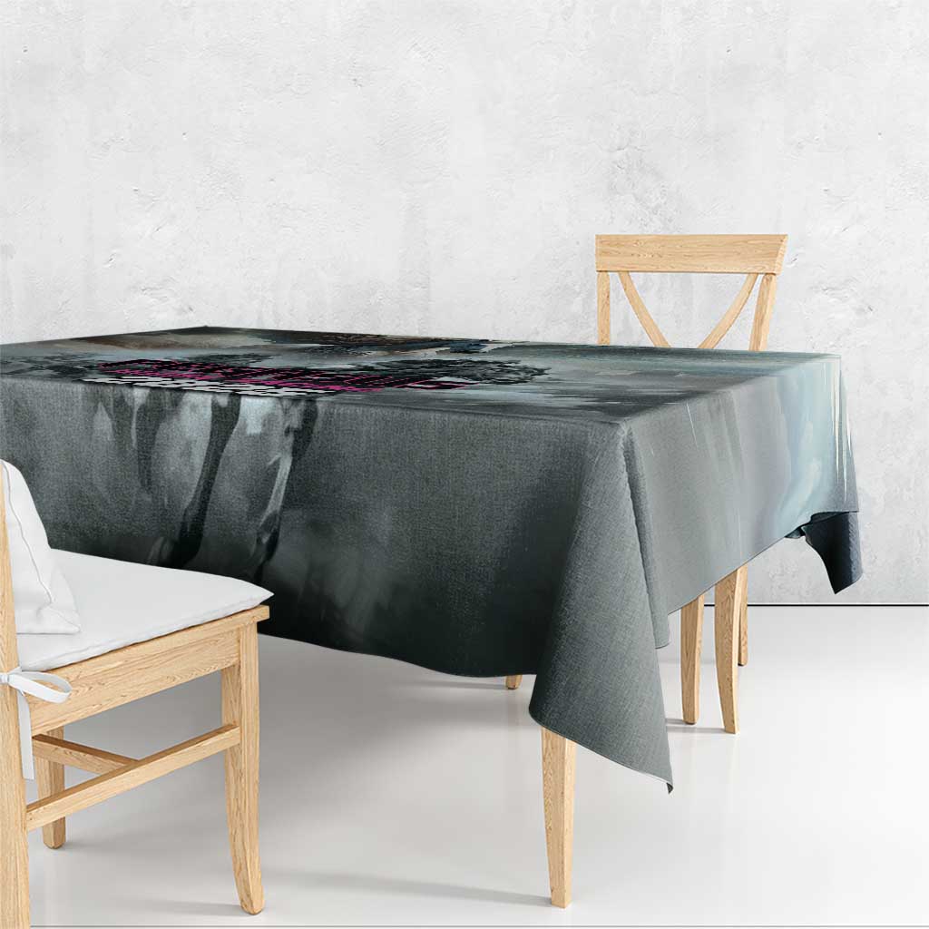 Gray tablecloth with overhanging edge on dining table, dark abstract pattern