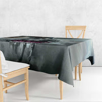 Gray tablecloth with overhanging edge on dining table, dark abstract pattern