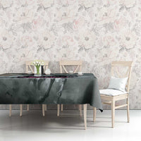 Gray tablecloth on dining table with dark abstract pattern and draped corners