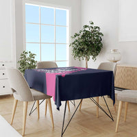 Navy and pink Pegasus horse racing tablecloth draped over round dining table