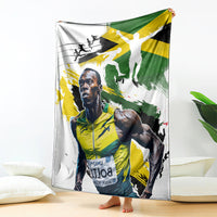 Jamaica blanket draped with white background and green/yellow athlete print