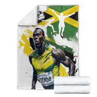 Jamaica blanket folded with white base and green/yellow athlete graphic