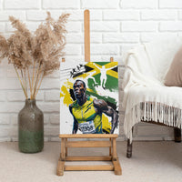 Framed canvas wall art on wooden easel with runner portrait in green and yellow.