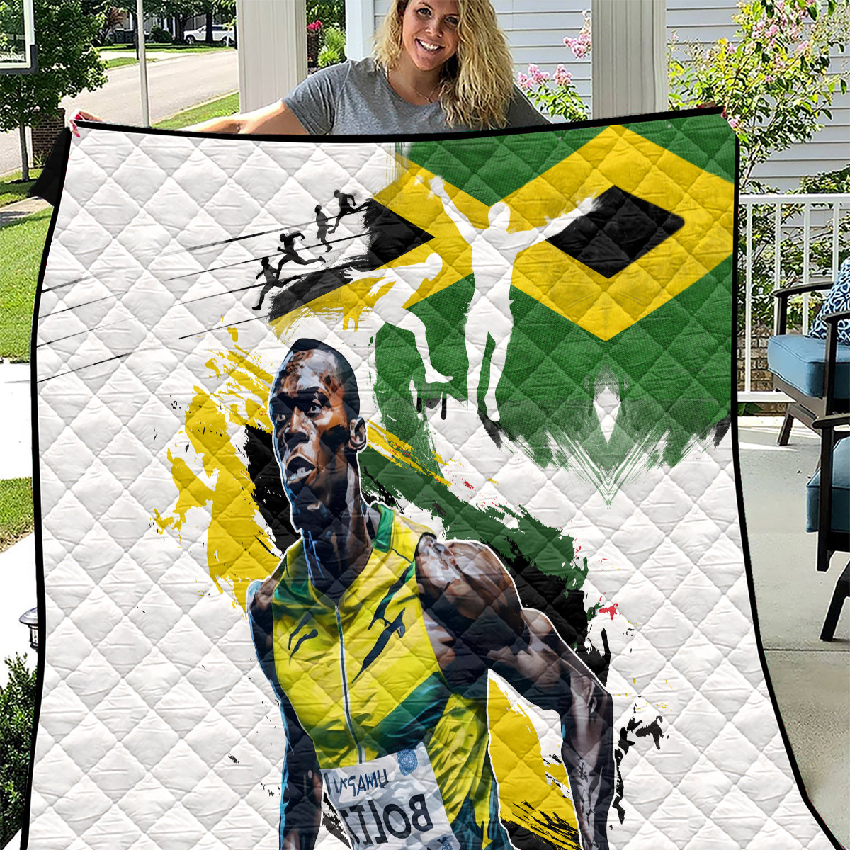 White quilt with Jamaica flag print and runner silhouettes, diamond-quilted texture.