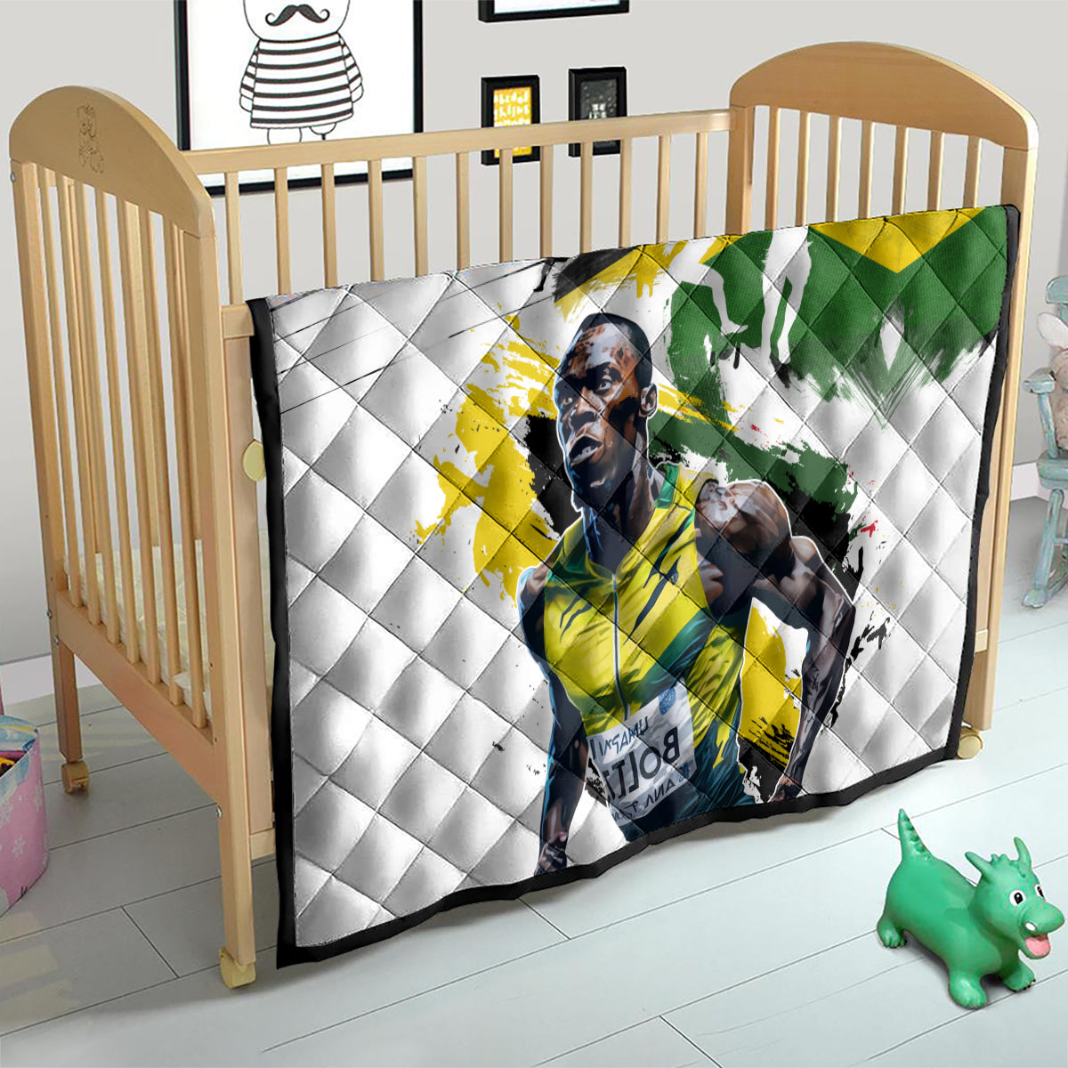 White quilt on child bed/crib, Jamaica flag graphic with diamond-quilted white backing.