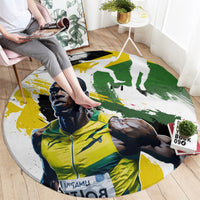 Round carpet with portrait artwork in yellow, green, and white under a foot