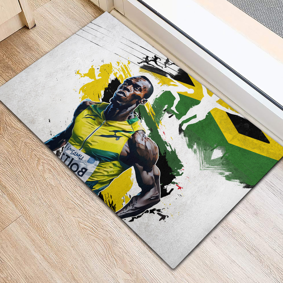 Rectangular rubber doormat with Jamaica flag splash design and athlete photo in yellow